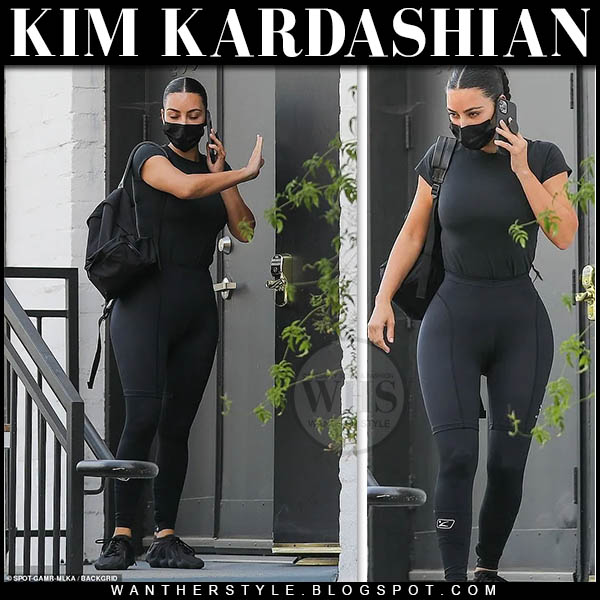 Kim Kardashian in black top and black leggings