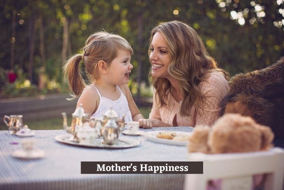 Happy Mother and Daughter Sitting on Chair