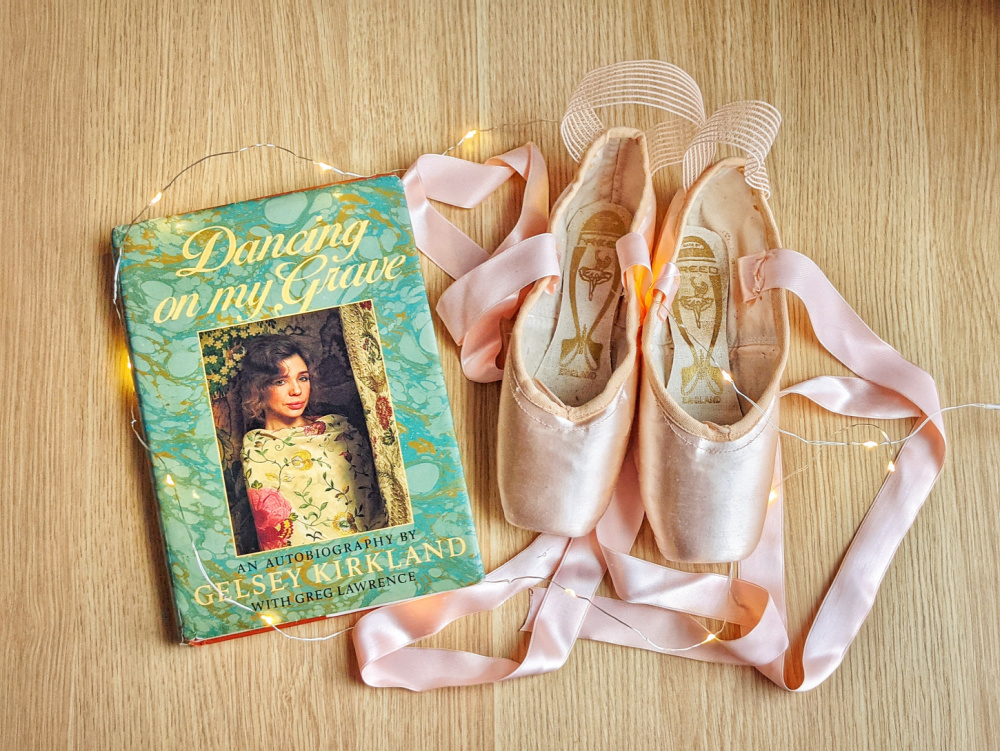 Autobiography Dancing On My Grave by Gelsey Kirkland, fairy lights, and pointe shoes.