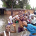 Residents Pose For Pictures In The Flood After Heavy Rainfall In Maiduguri 