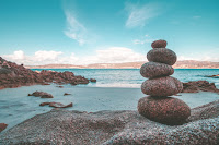 Rock Column on Beach - Photo by Alejandro Piñero Amerio on Unsplash