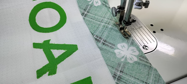 Adding borders with 4-H fabric