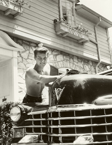 Robert Wagner shines his maroon 1947 Cadillac convertible