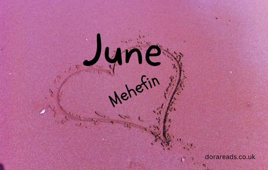 Title: June - Mehefin. Image: heart drawn in the sand.