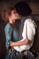 Ross Poldark kissing Demelza while she is wearing his mother's blue dress