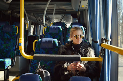 Woman on bus with headphones