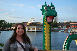 Megs standing in front of a Lego sculpture of a dragon outside the Lego store in Downtown Disney.