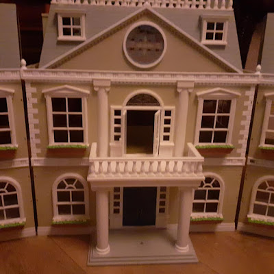 converting a dolls house to fairy house garden