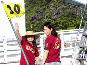 young Okinawan woman waving