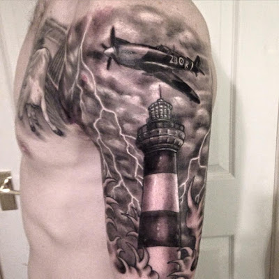 Plane Lighthouse sleeve tattoo