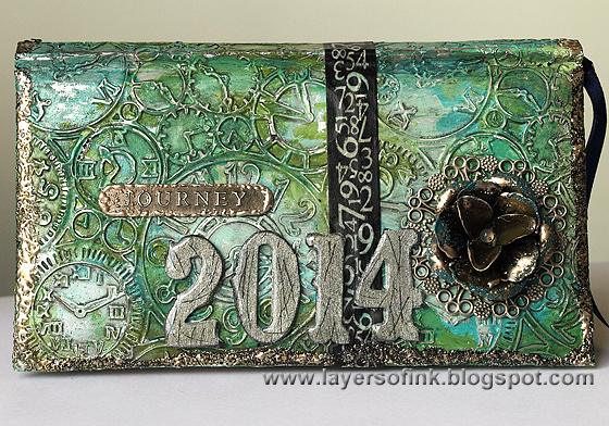 http://layersofink.blogspot.com/2014/01/altered-artsy-almanac.html