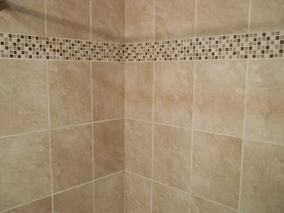 glass mosaic accent band makes basic tile look fantastic