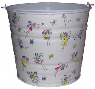 white pail with pictures of fairies