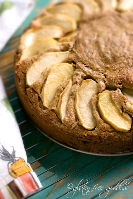 Apple cake batter in the pan, ready to bake, topped with sliced fresh apples