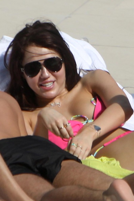  of Miley Cyrus in Miami yesterday that reveal the "Just Breathe" tattoo 