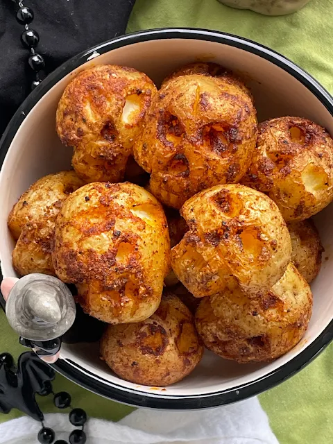 Bowl of roasted potato skulls.