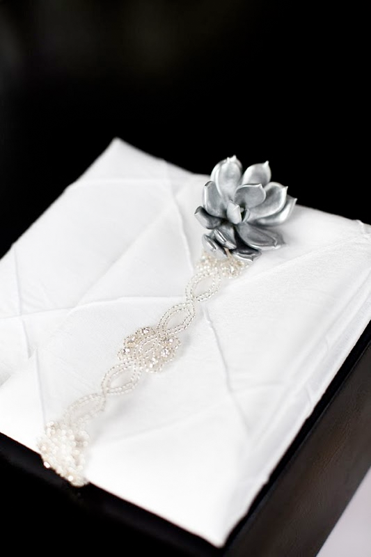  the white candlesticks and how lovely the napkins are decorated