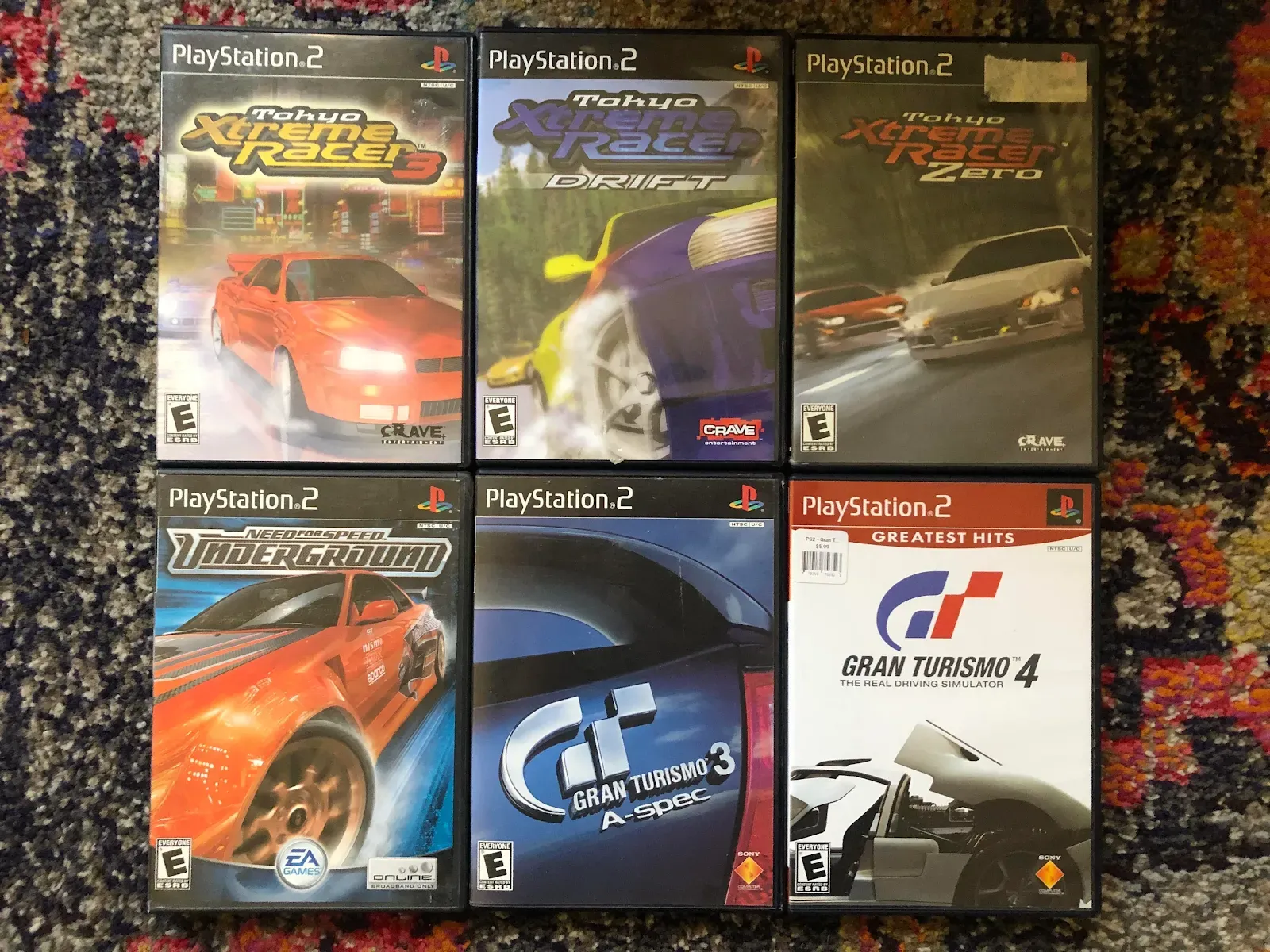 Display of various PS2 racing game covers