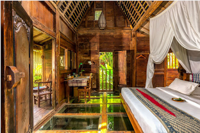 Glass-bottomed bedroom at Bambu Indah