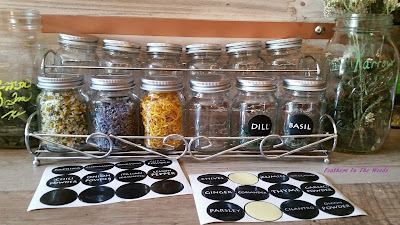 Oven dried herbs stored in glass jars with labels