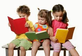 kids reading books on a bench