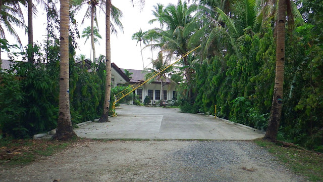 end of dirt path entrance to Kuting Reef Resort and Spa in Macrohon Southern Leyte