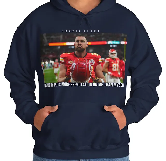 A Hoodie With NFL Player Travis Kelce Taking Off His Helmet and Quote Nobody Puts More Expectation on Me Than Myself