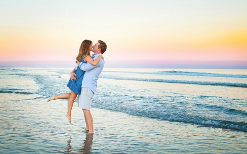 Sweet Romantic Couple Kissing on Beach