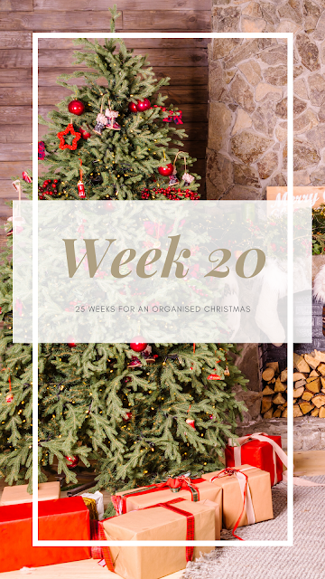 Festive scene with a tree and gifts with Week 20 in text across the front