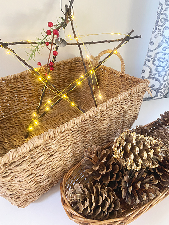 basket with stick star and pinecones