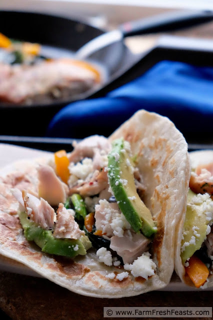 Flakes of seasoned fish set against sautéed bok choy and peppers in a warm tortilla, topped with avocado slices and crumbled queso. Use the farm share in unexpected ways with these tacos.