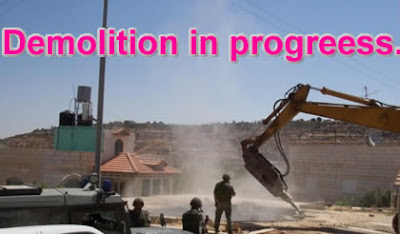 Israeli officers demolish the house