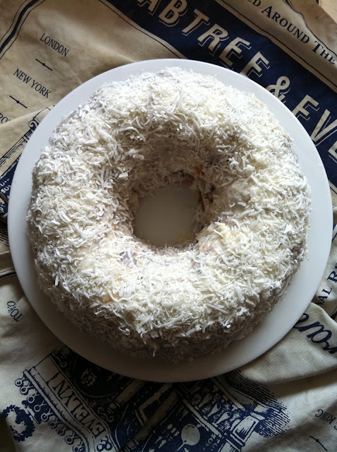 Southern Spoon blog: triple berry buttermilk bundt cake topped with lemon glaze and coconut