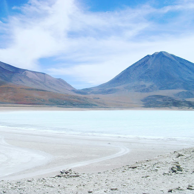 white lake and mountain in bolivia