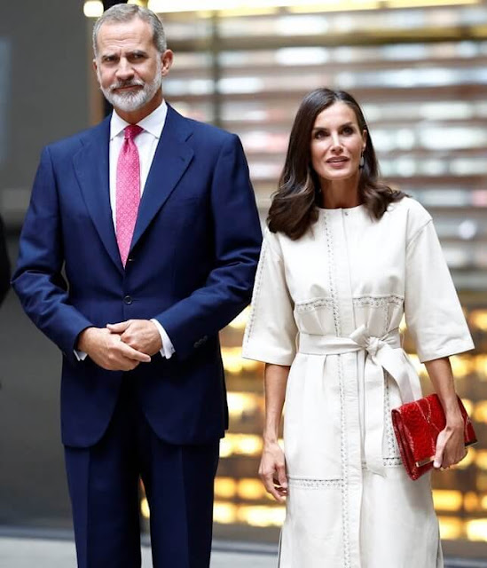 Queen Letizia wore a new nappa leather dress with embroidery by Massimo Dutti. Carolina Herrera red leather clutch and pumps