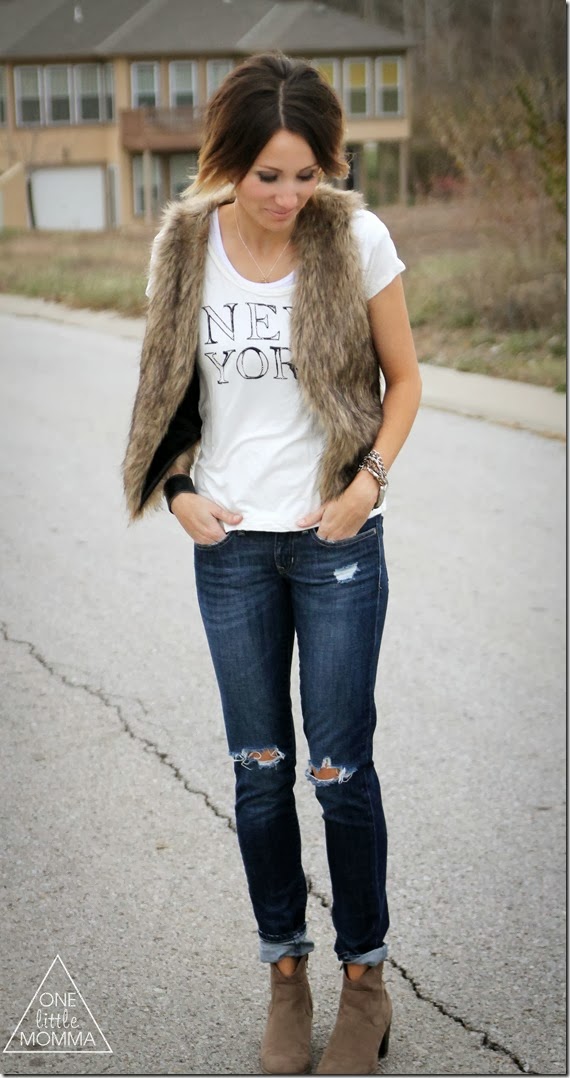 Fur vest, graphic tee and dark denim