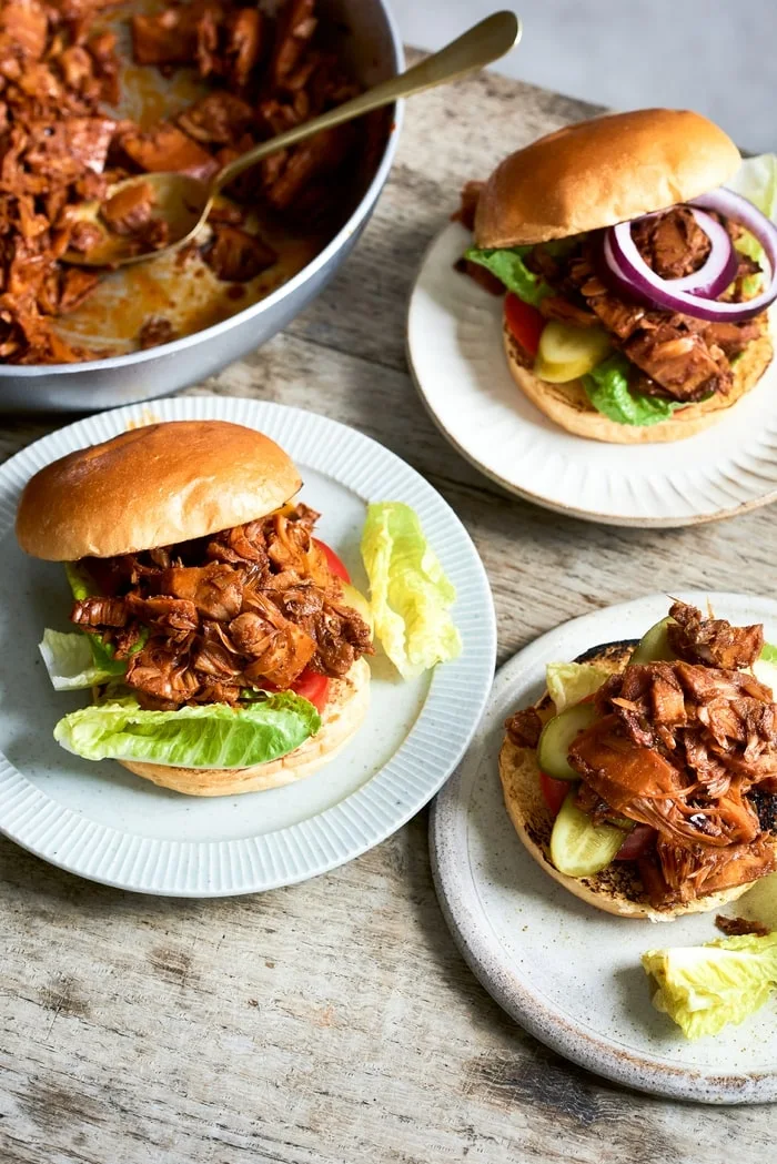 Vegan Pulled Jackfruit Burgers with salad on burger buns