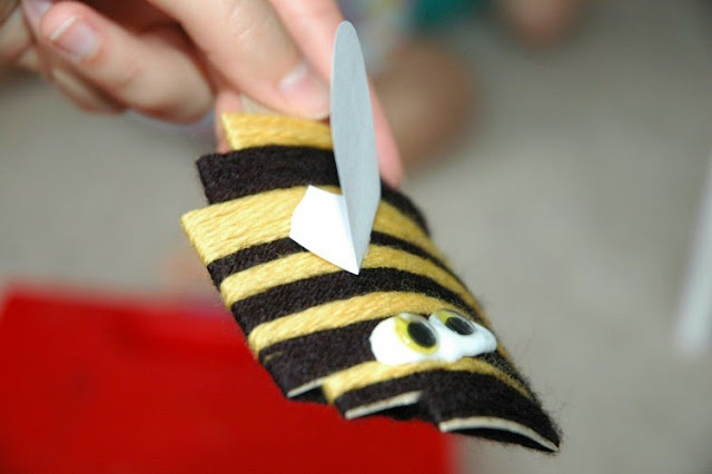 Yarn wrapped bumblebees fine motor insect craft for kids