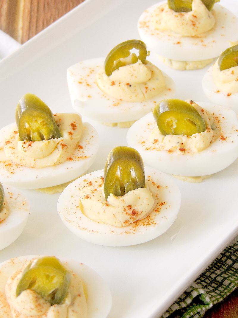 Jalapeno Popper Deviled Eggs on a white serving tray.