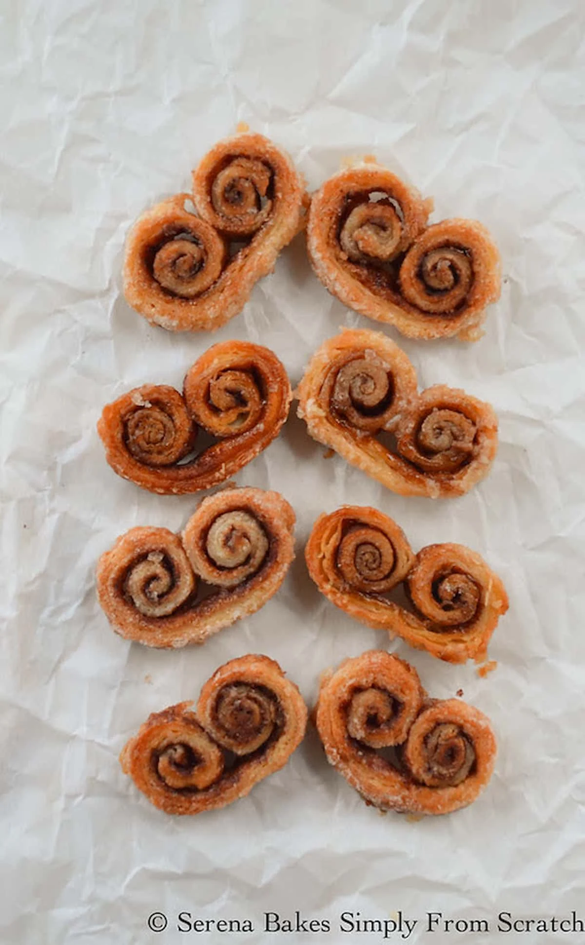 A down shot of Angel Wing Cookies on parchment paper.