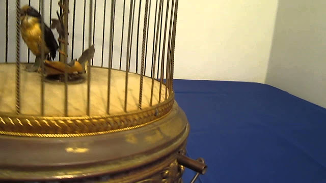 Mechanical Birds In Cage