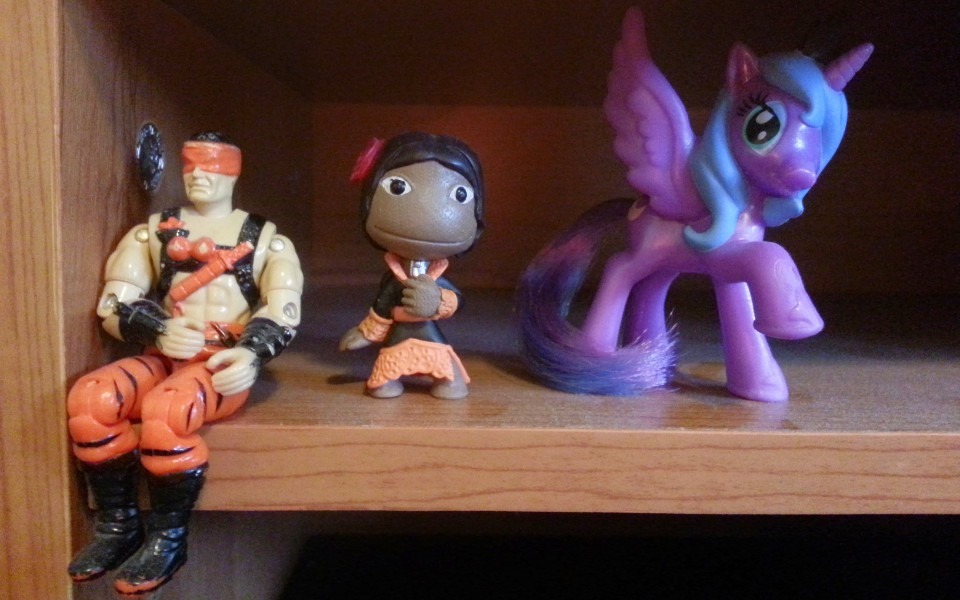 Desk figurines of a G.I. Joe, a Sackboy from Little Big Planet, and Luna from My Little Pony