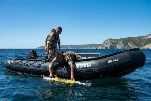 Italian explosive ordnance disposal team operates a UUV, unmanned underwater vehicle, in NATO exercises in September in Portugal. (NATO)