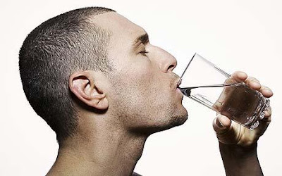 Man Drinking Water inwards the Morning