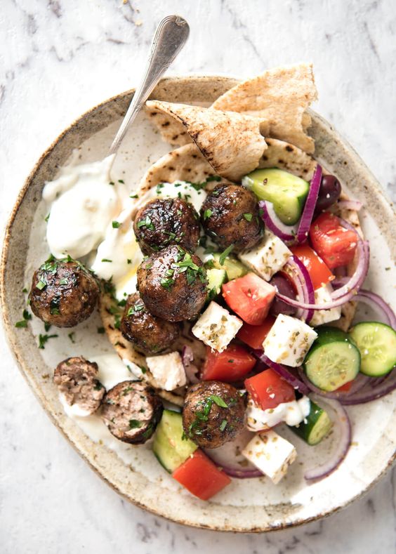 Juicy Greek Meatballs (Keftedes), beautifully flavoured with red onion, parsley, a hint of mint and dried oregano with a slightly crispy surface. See recipe video below.