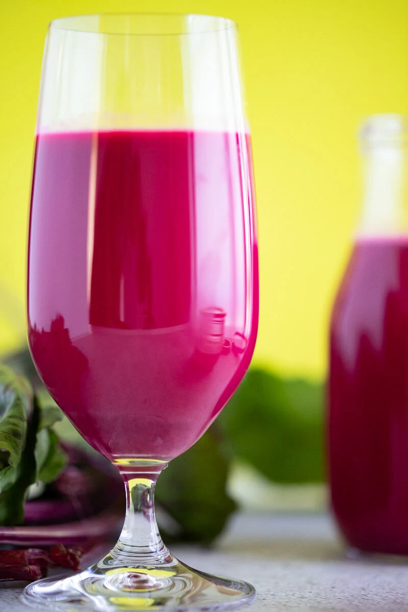 Chilled beetroot punch in a tall glass ready to be served.