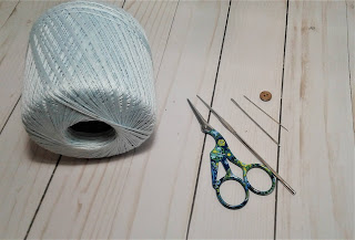 materials cotton thread, crochet hook, needle, yarn needle and scissors