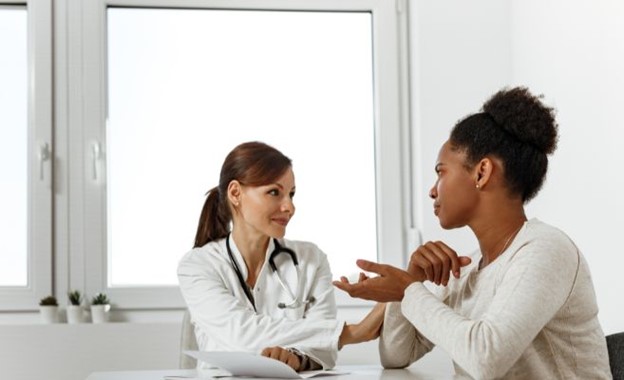 Image of lady saving money by seeing a campus doctor.