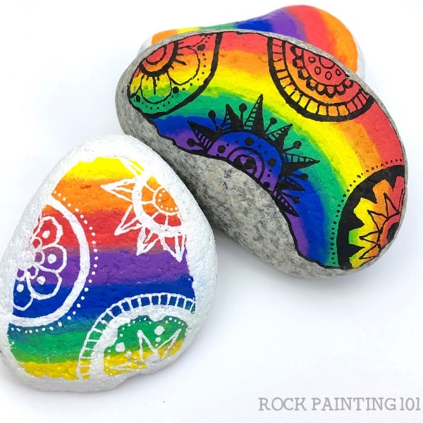 how to paint rocks with a rainbow background