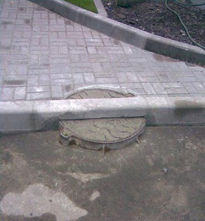Road over manhole construction fail
